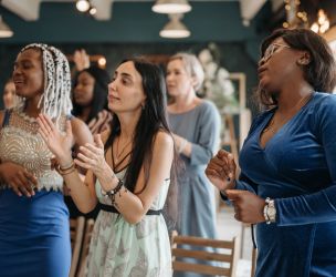 A Group of Women Singing Together